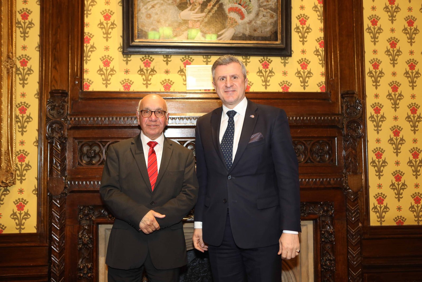 Two guests photographed together during the presentations at the London ceremony