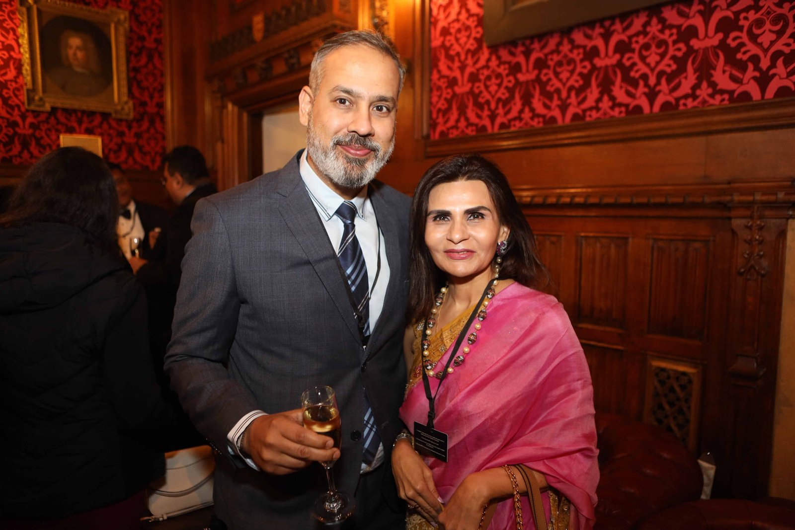 Two guests at the evening reception in the Cholmondeley Room