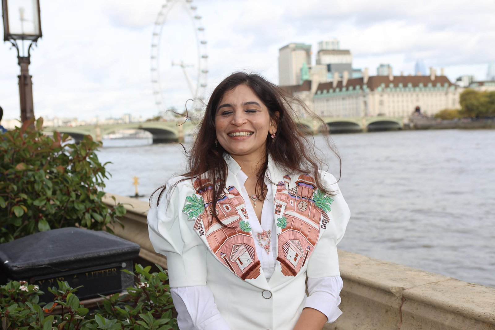 A leader interviewed on the Parliamentary terrace, the London Eye behind