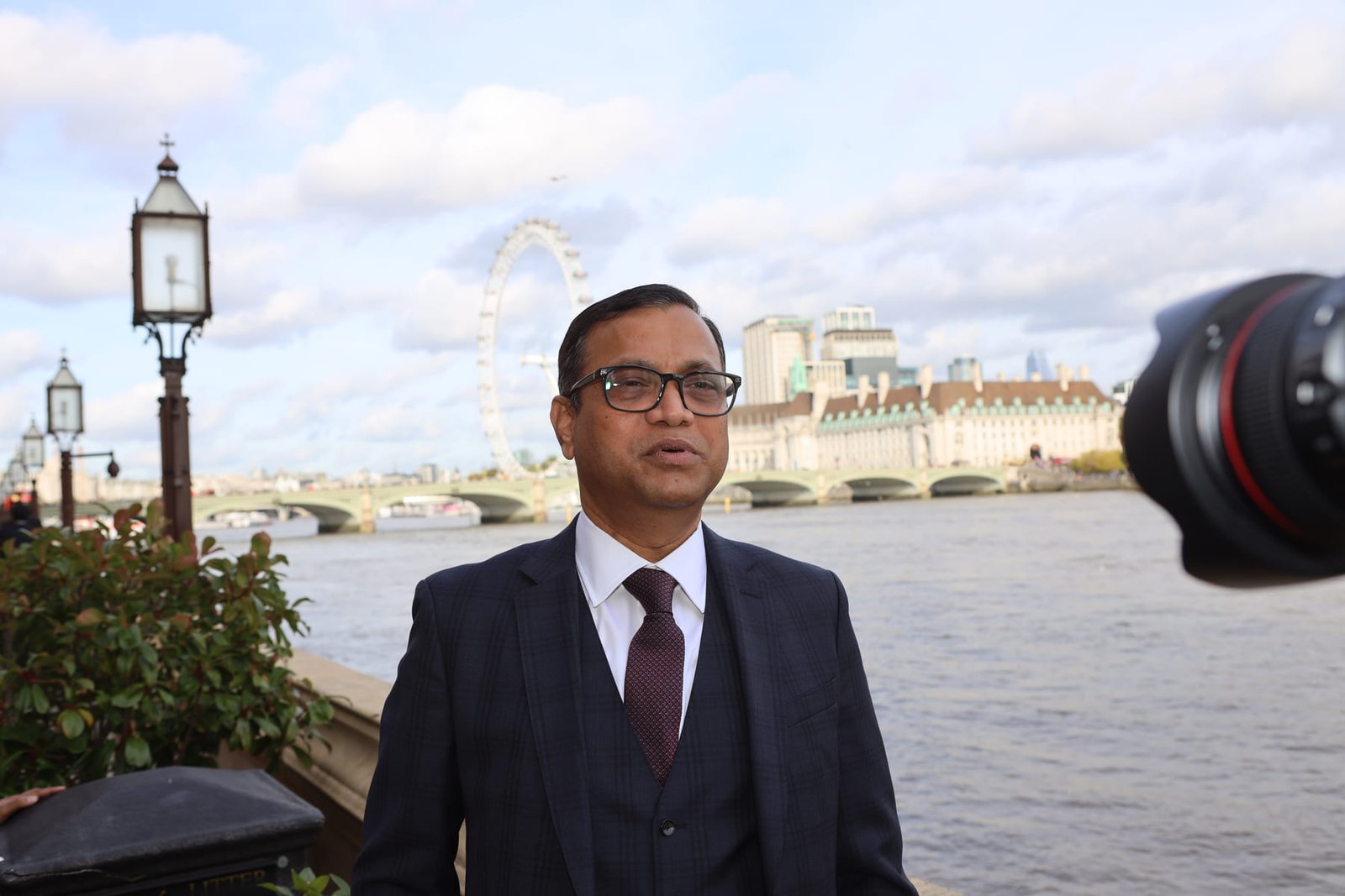 A leader gives an interview to camera on the Parliamentary terrace